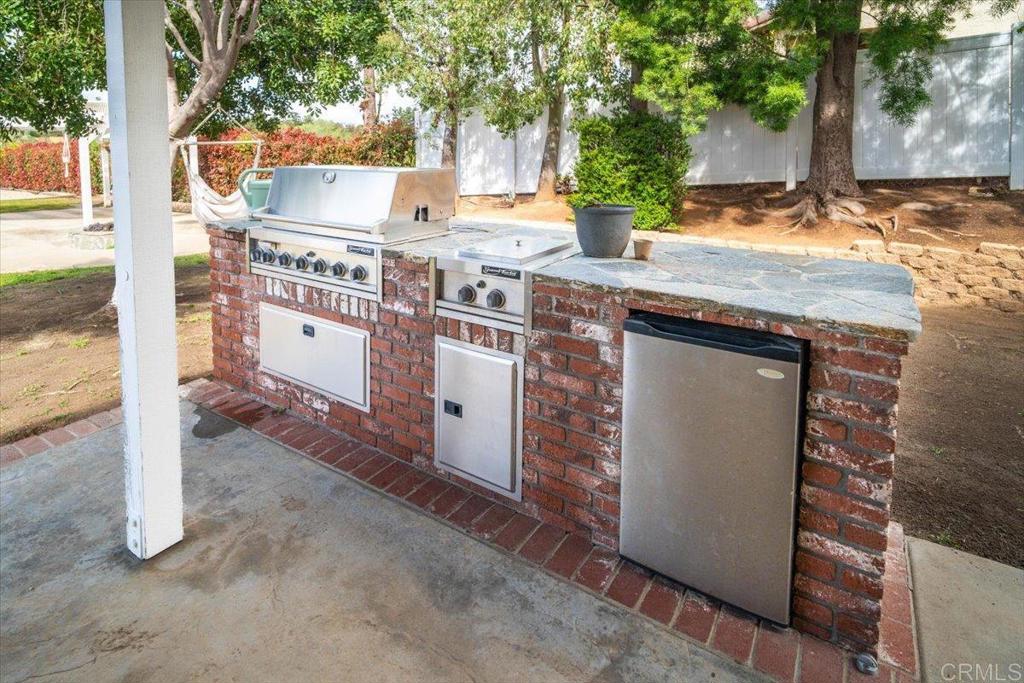 25057 Poderio Drive Ramona, CA 92065 - Photo 29 of 36 a view of a house with backyard