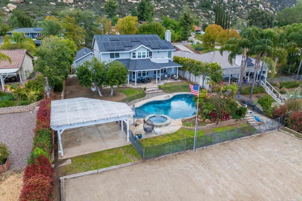25057 Poderio Drive Ramona, CA 92065 - Photo 30 of 36 an aerial view of a house with a garden and a pathway