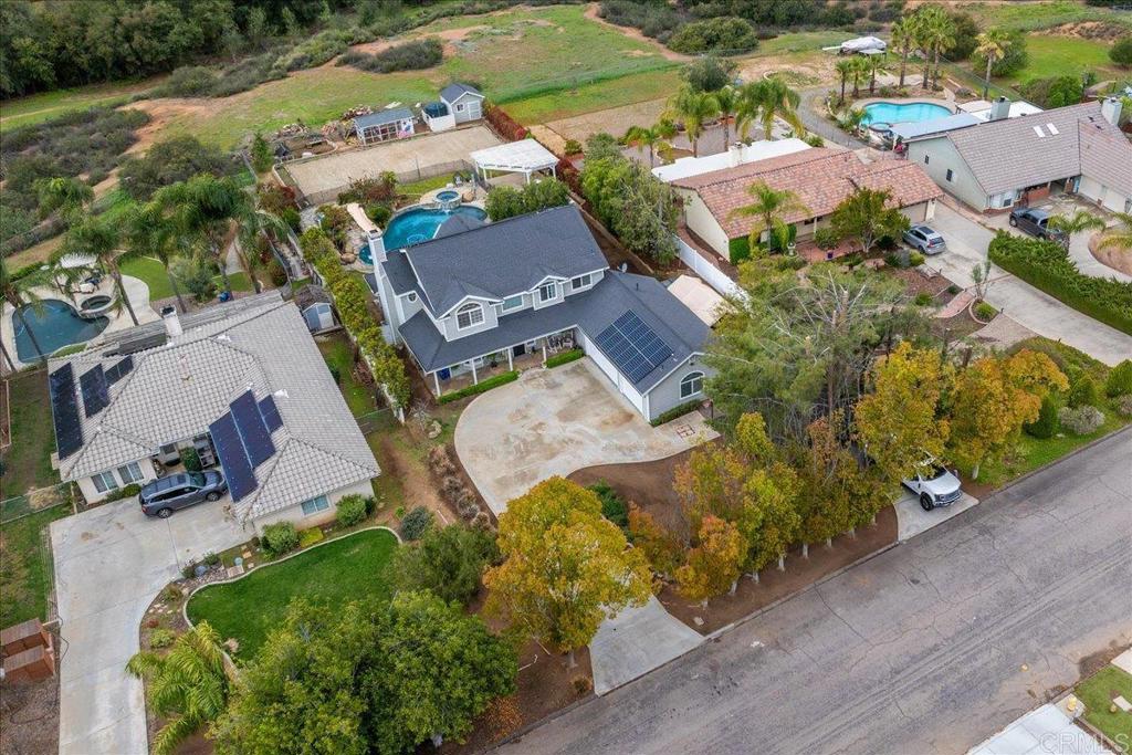 25057 Poderio Drive Ramona, CA 92065 - Photo 3 of 36 an aerial view of a house with a garden