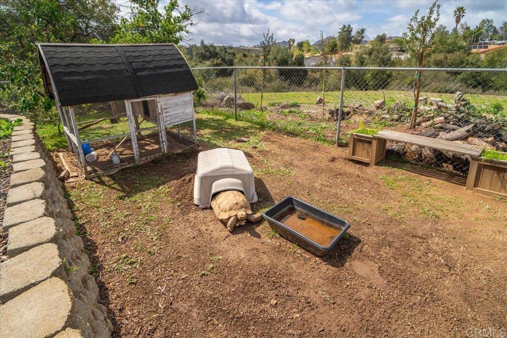 25057 Poderio Drive Ramona, CA 92065 - Photo 35 of 36 a backyard of a house with outdoor seating
