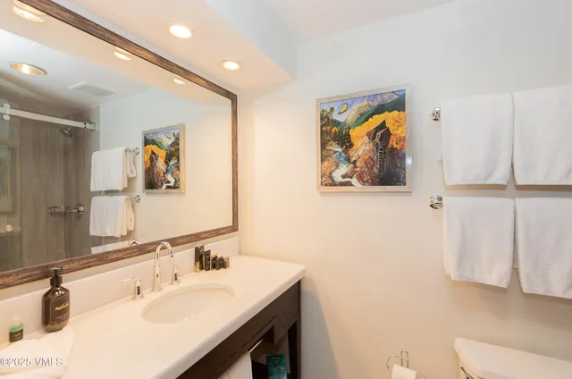 a bathroom with a shower and a mirror