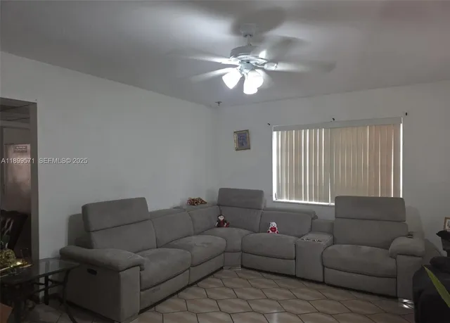 a living room with furniture and a window