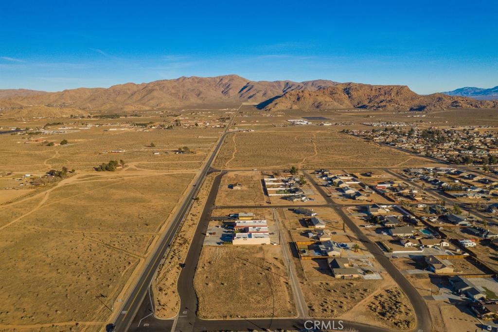 706 Outer Highway 18 North Apple Valley, CA 92308 - Photo 1 of 13 an aerial view of residential houses with outdoor space