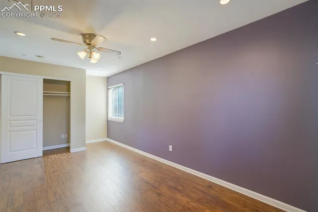 a white toilet sitting next to a window