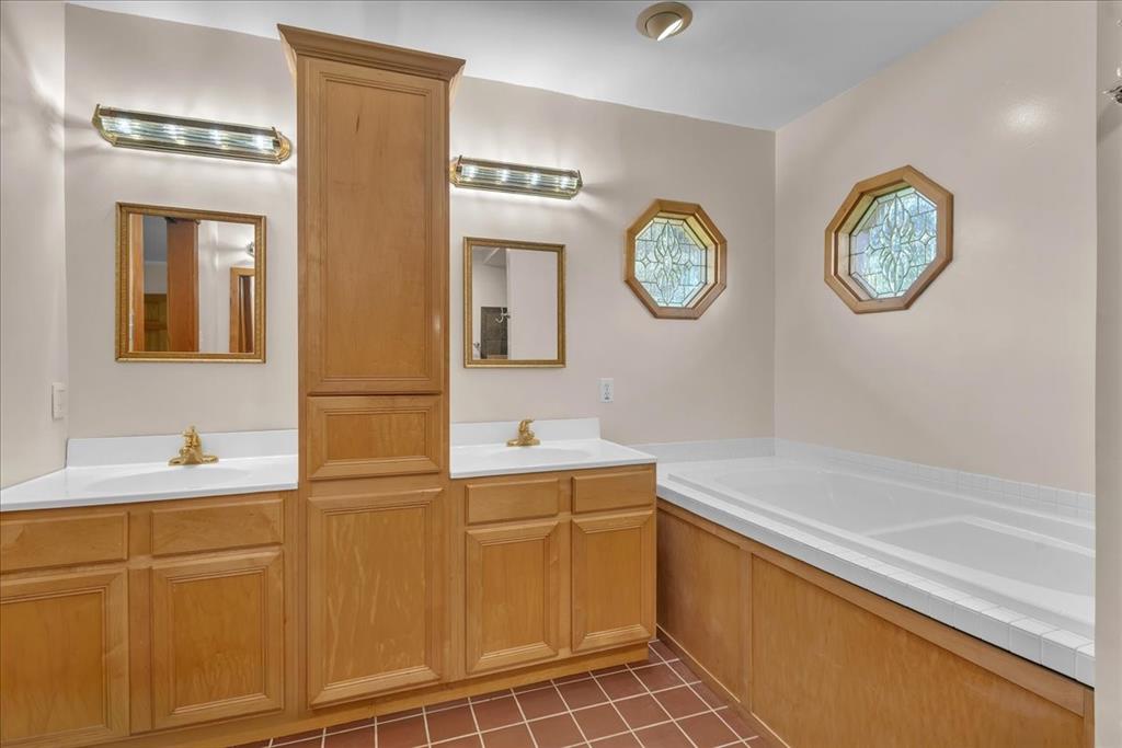 1900 South Duncanville Road Red Oak, TX 75154 - Photo 19 of 39 Primary bathroom with dual sinks and jetted tub. Notice the cute windows!