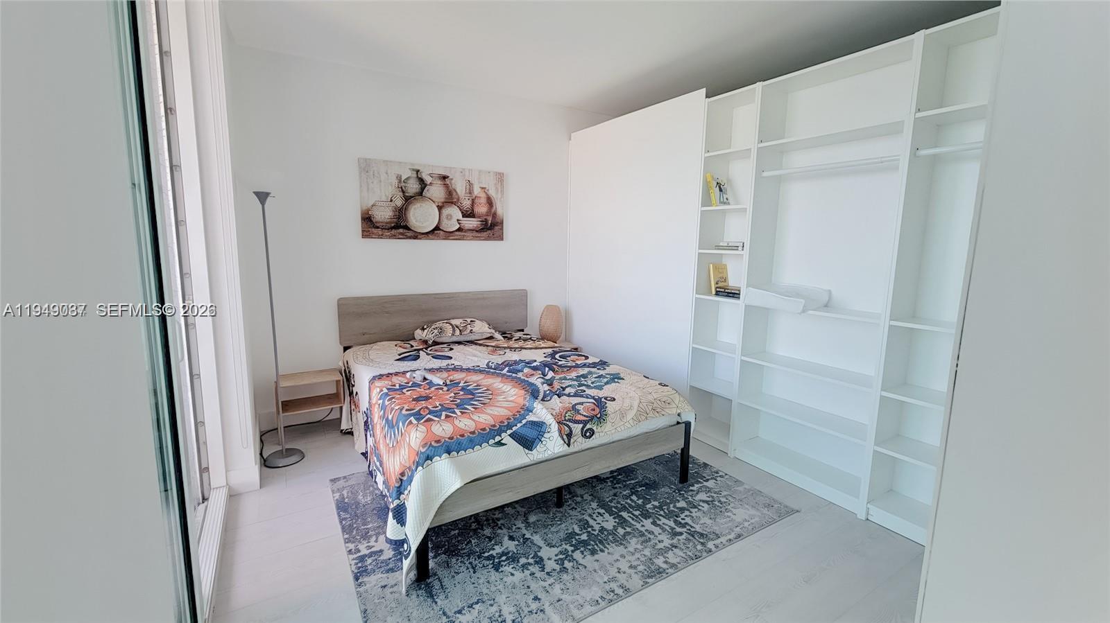 253 Northeast 2nd Street, Unit 3305 Miami, FL 33132 - Photo 7 of 7 a bedroom with a bed and a window