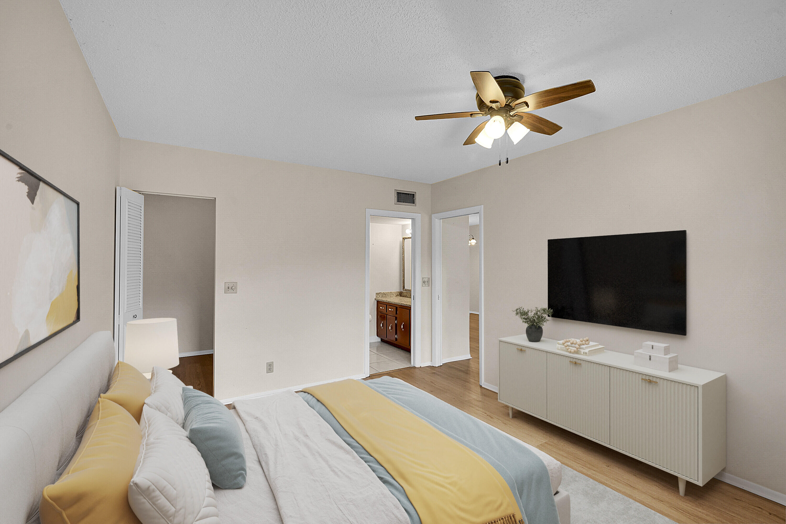 2340 Southwest 22nd Avenue, Unit 306 Delray Beach, FL 33445 - Photo 16 of 33 a bedroom with a bed and a flat screen tv