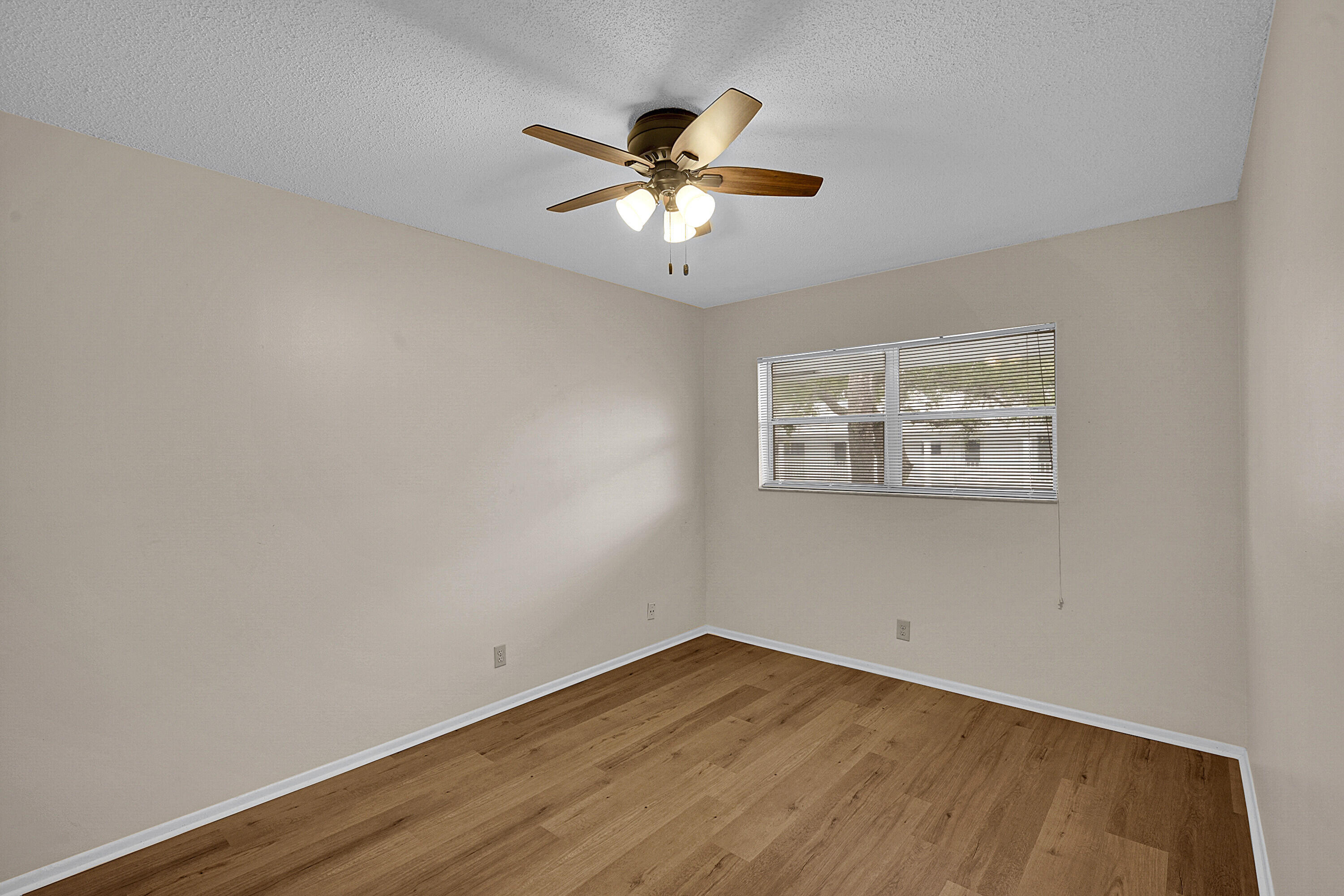 2340 Southwest 22nd Avenue, Unit 306 Delray Beach, FL 33445 - Photo 24 of 33 a view of empty room with wooden floor