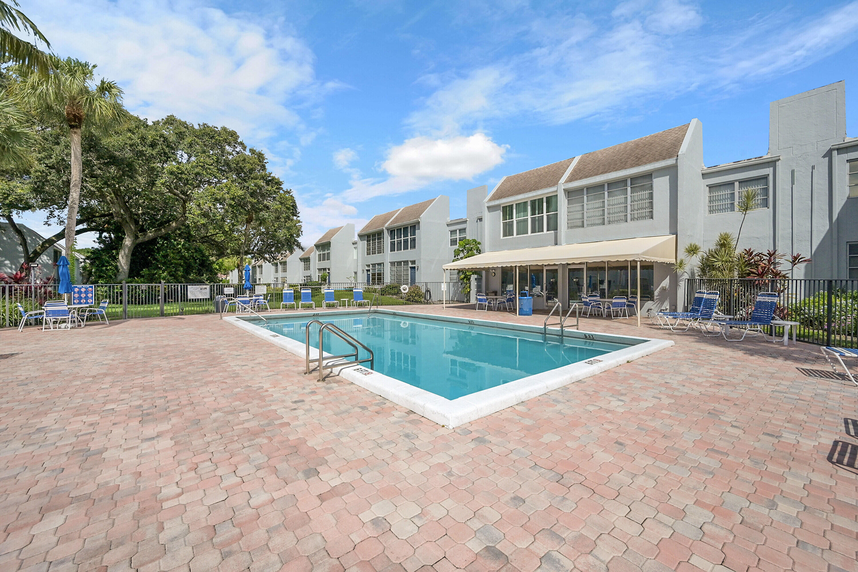 2340 Southwest 22nd Avenue, Unit 306 Delray Beach, FL 33445 - Photo 31 of 33 a view of pool with outdoor seating