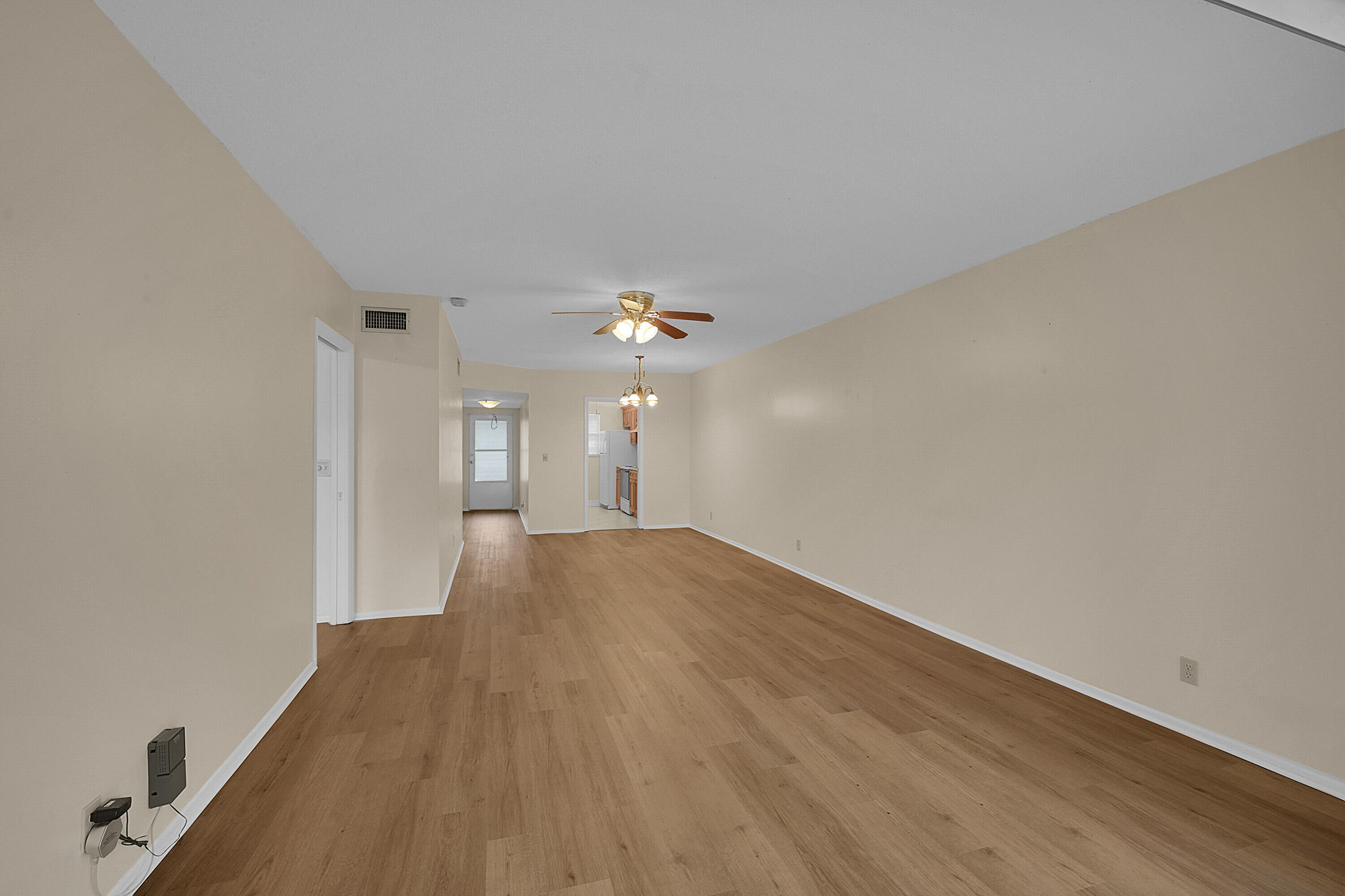 2340 Southwest 22nd Avenue, Unit 306 Delray Beach, FL 33445 - Photo 6 of 33 a view of a room with wooden floor