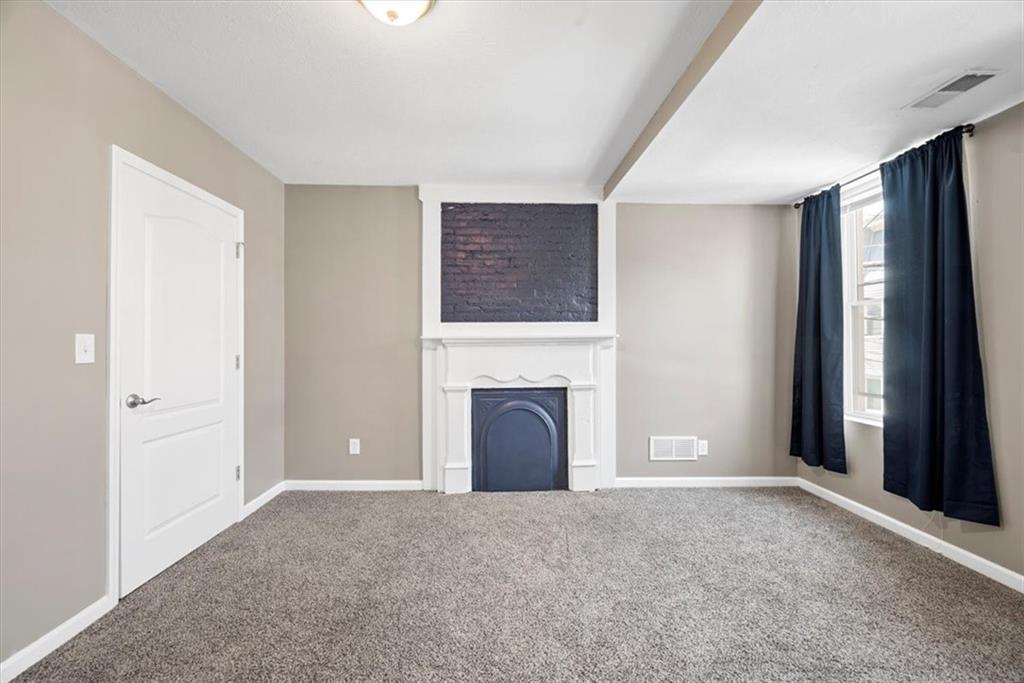245 37th Street Pittsburgh, PA 15201 - Photo 14 of 29 a view of a livingroom with a fireplace cabinet and window