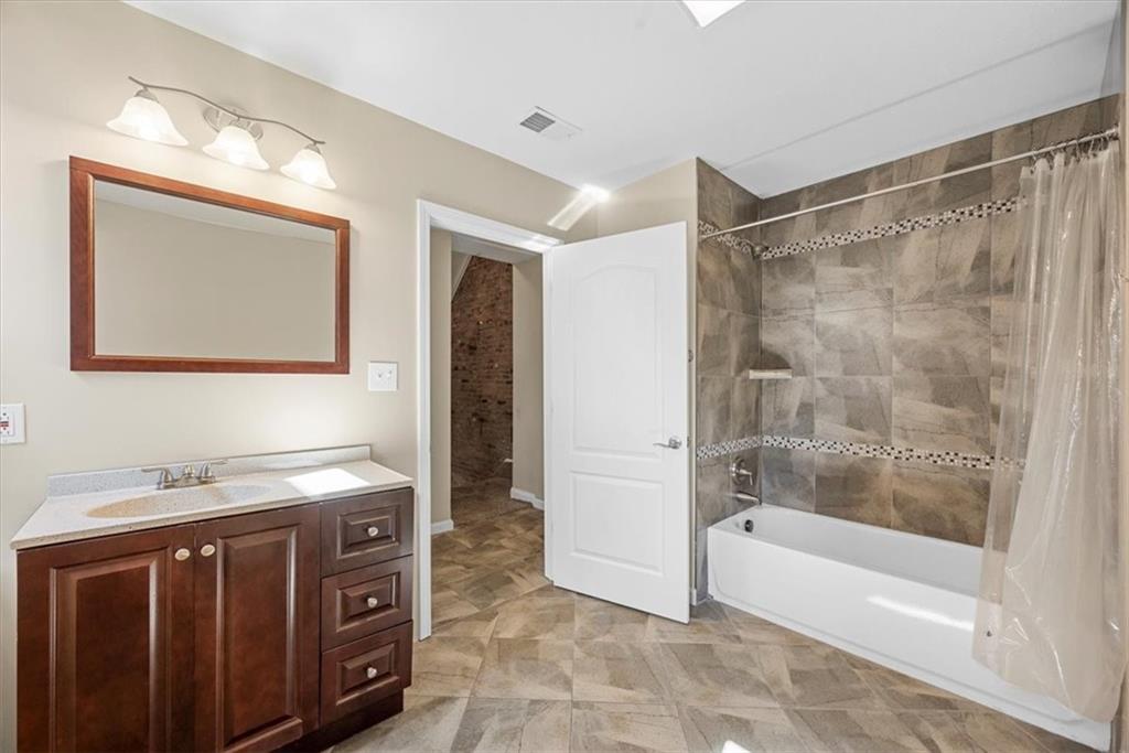 245 37th Street Pittsburgh, PA 15201 - Photo 18 of 29 a bathroom with a sink and a mirror