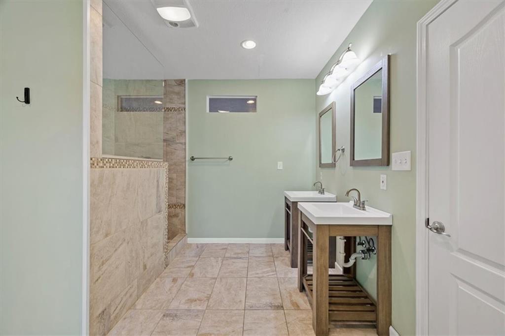 245 37th Street Pittsburgh, PA 15201 - Photo 20 of 29 a bathroom with a sink and a mirror