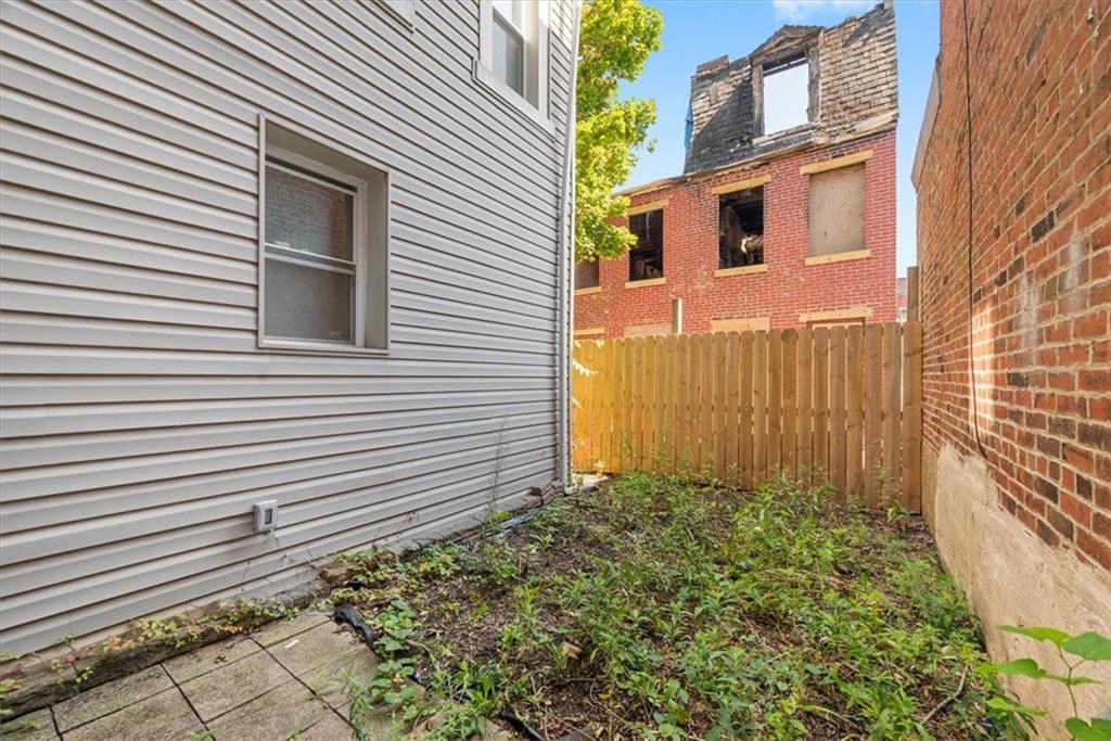 245 37th Street Pittsburgh, PA 15201 - Photo 28 of 29 a view of a house with a small yard