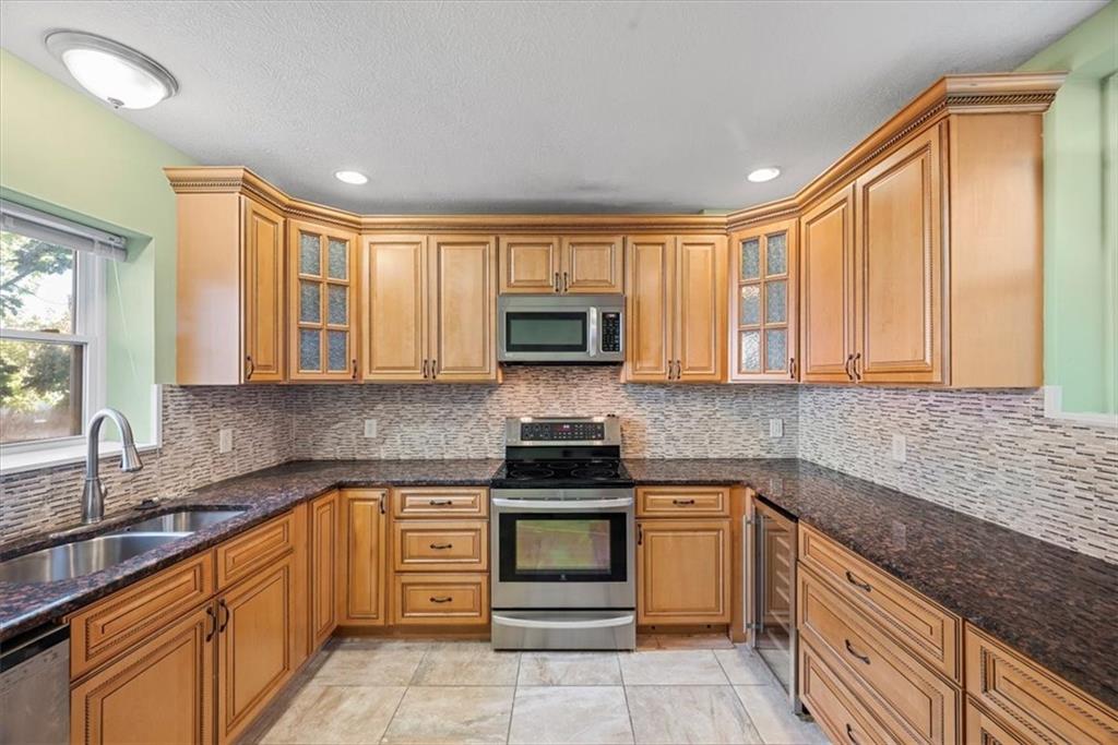 245 37th Street Pittsburgh, PA 15201 - Photo 7 of 29 a kitchen with white cabinets and appliances
