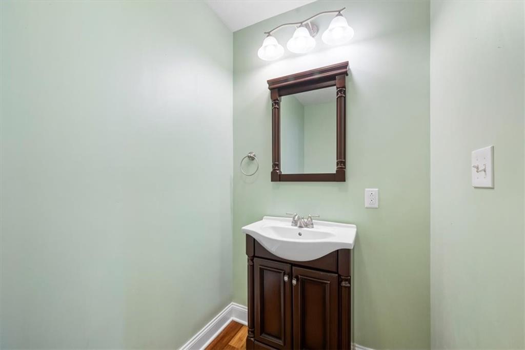 245 37th Street Pittsburgh, PA 15201 - Photo 10 of 29 a bathroom with a sink and a mirror