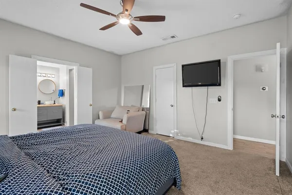 a bedroom with a bed and window