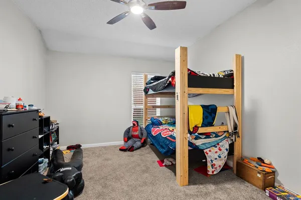a bathroom with a granite countertop sink mirror and vanity