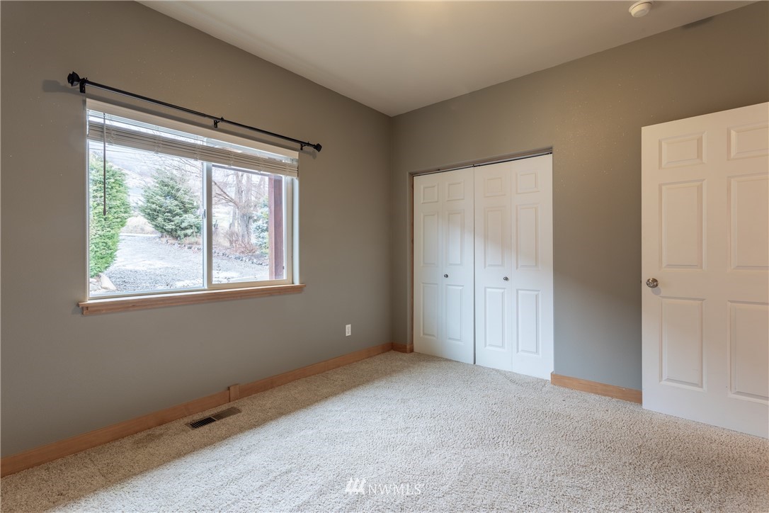 2805 Squilchuck Road Wenatchee, WA 98801 - Photo 18 of 34 a view of an empty room with a window