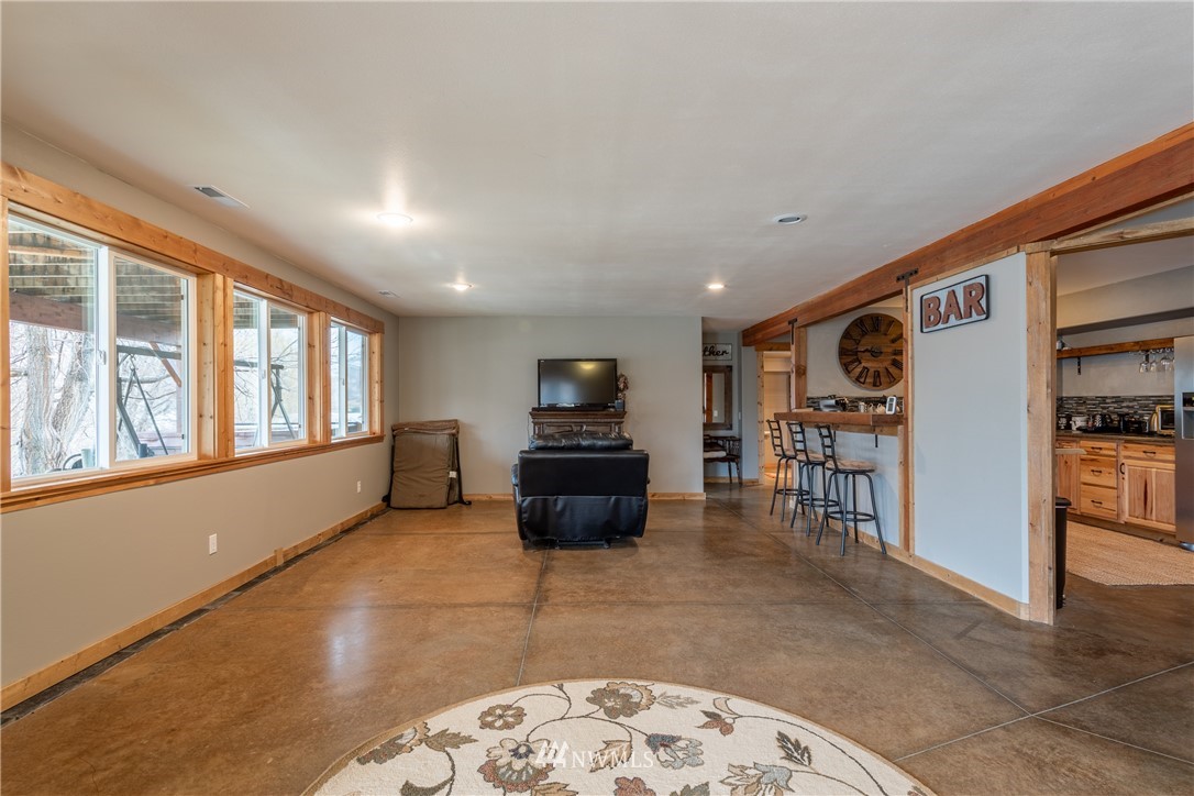 2805 Squilchuck Road Wenatchee, WA 98801 - Photo 19 of 34 a living room with furniture and a flat screen tv
