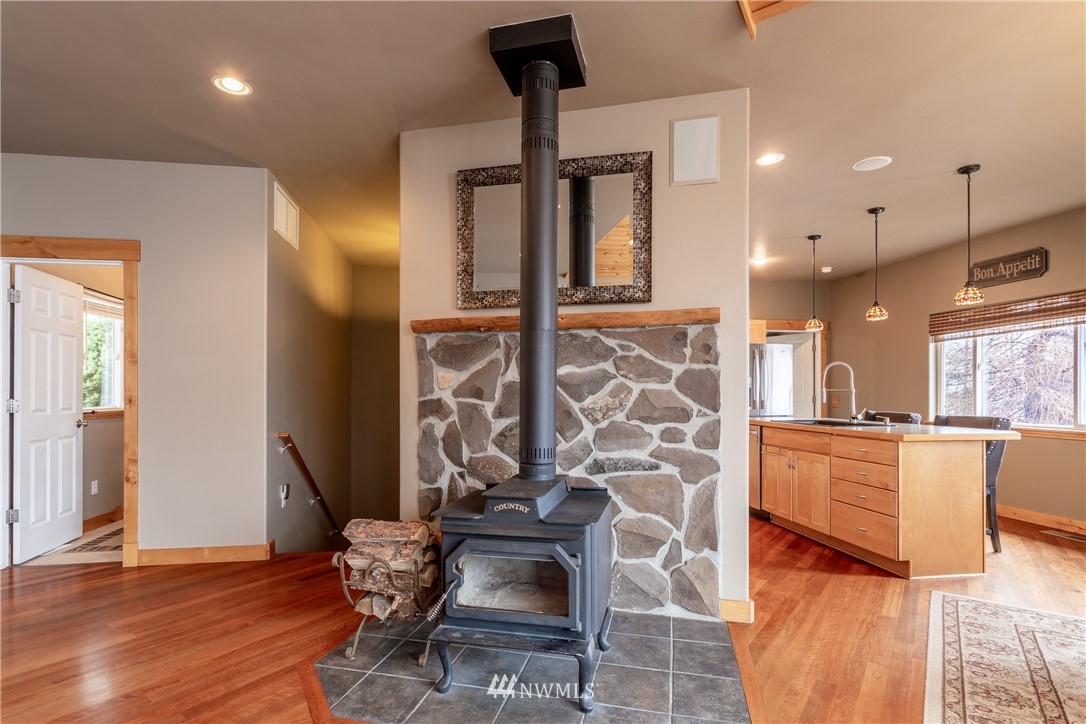 2805 Squilchuck Road Wenatchee, WA 98801 - Photo 7 of 34 a kitchen with granite countertop a stove and a wooden floors