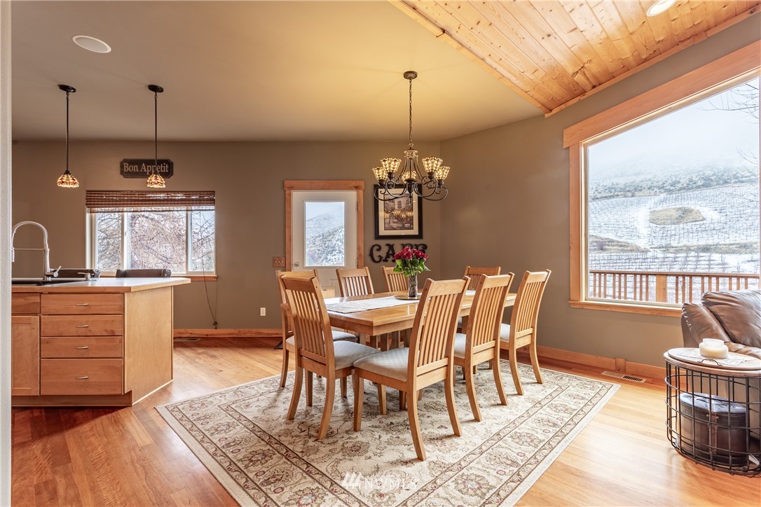 2805 Squilchuck Road Wenatchee, WA 98801 - Photo 8 of 34 a view of a dining room with furniture window and wooden floor