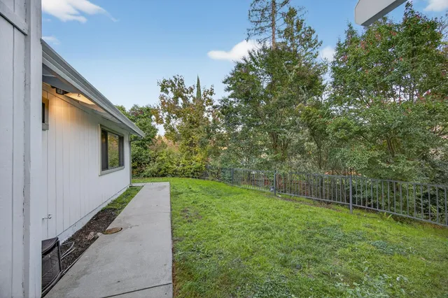 a view of a back yard of the house