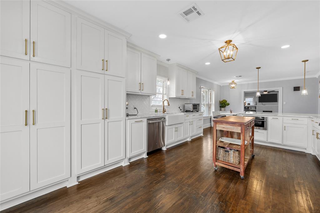 628 North 33rd Street Waco, TX 76710 - Photo 11 of 35 a kitchen with white cabinets and stainless steel appliances