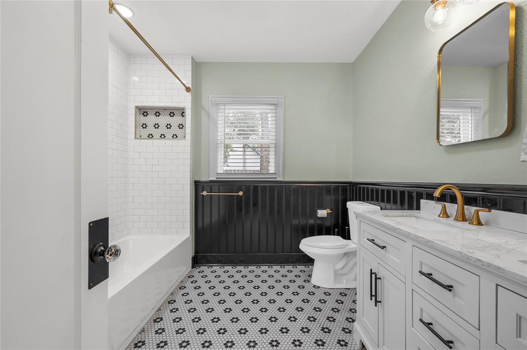 628 North 33rd Street Waco, TX 76710 - Photo 26 of 35 a bathroom with a sink a toilet a window and vanity