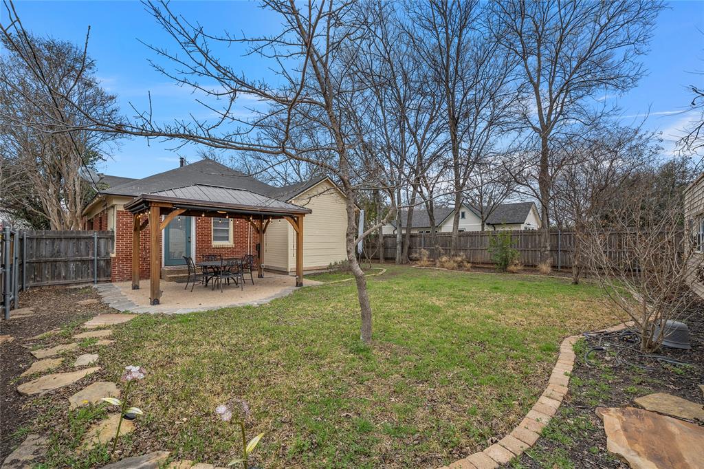 628 North 33rd Street Waco, TX 76710 - Photo 34 of 35 a view of a house with a yard patio and fire pit