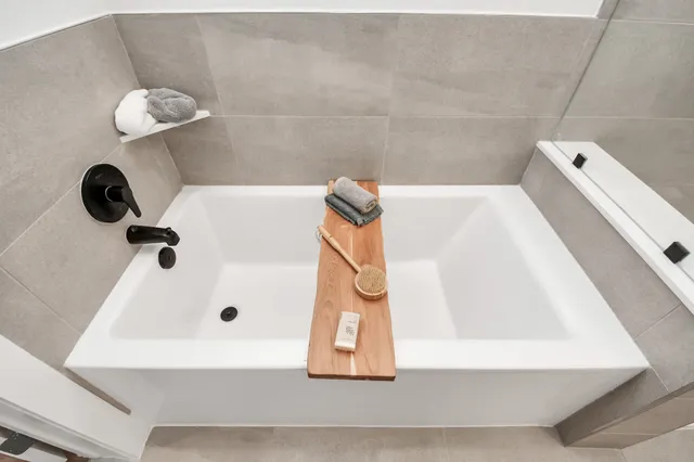 a large room with table chairs and wooden floor