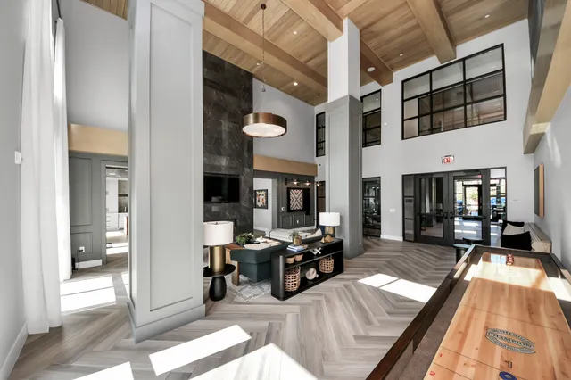 a view of a dining room kitchen with furniture and wooden floor