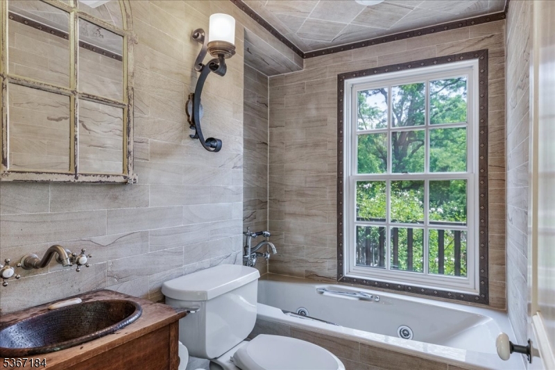 936 Dove Island Road Newton, NJ 07860 - Photo 18 of 50 a bathroom with a toilet a sink and bathtub