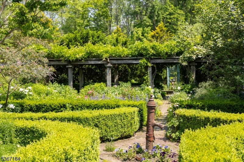 936 Dove Island Road Newton, NJ 07860 - Photo 29 of 50 a front view of a house with a yard and potted plants