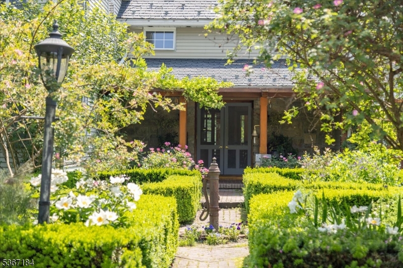 936 Dove Island Road Newton, NJ 07860 - Photo 3 of 50 a front view of a house with a garden