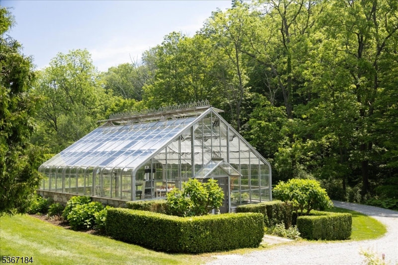 936 Dove Island Road Newton, NJ 07860 - Photo 47 of 50 a view of a white house with a big yard and potted plants