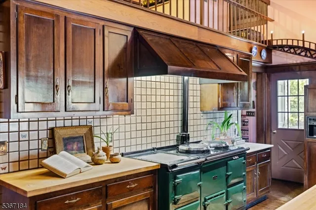 a kitchen with a stove and cabinets