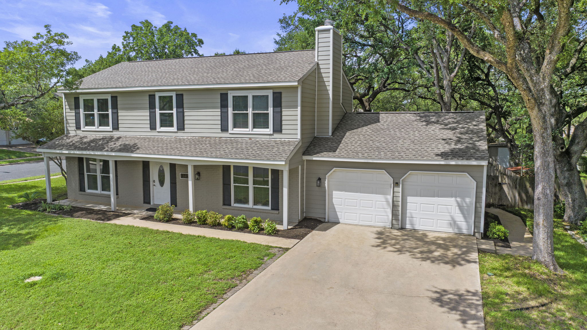 front view of a house with a yard