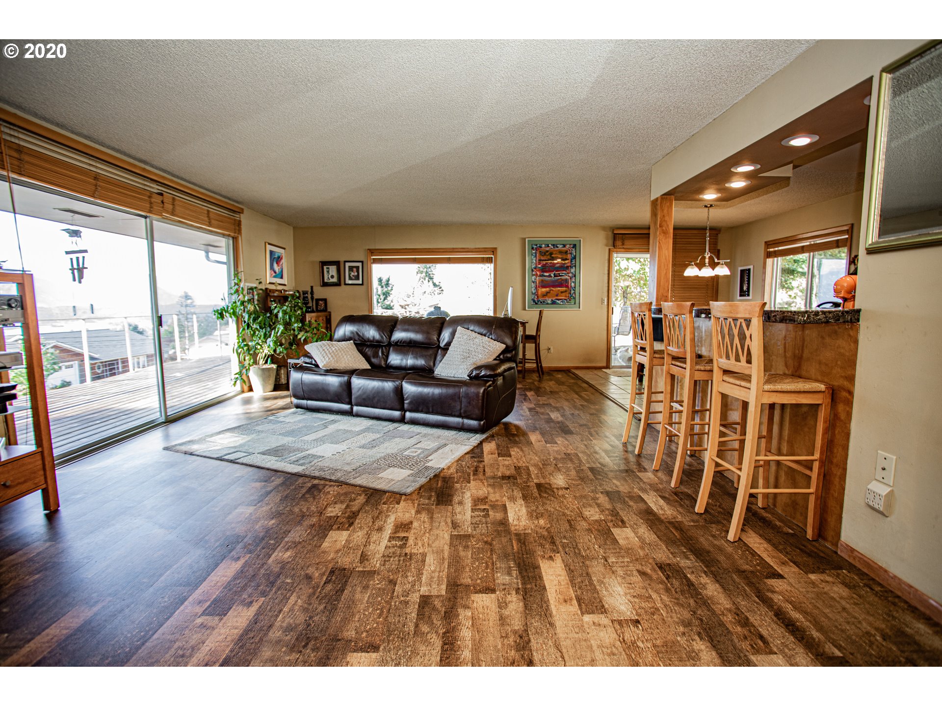 250 Ridgecrest Drive Stevenson, WA 98648 - Photo 9 of 32 a living room with furniture wooden floor and a large window