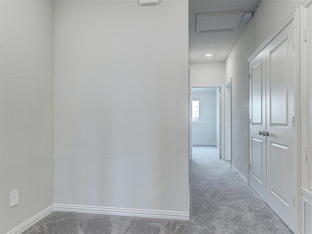 3337 Solana Circle Denton, TX 76207 - Photo 14 of 22 Corridor with carpet and attic access