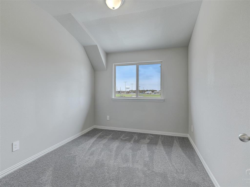 3337 Solana Circle Denton, TX 76207 - Photo 19 of 22 Unfurnished room with dark colored carpet and baseboards
