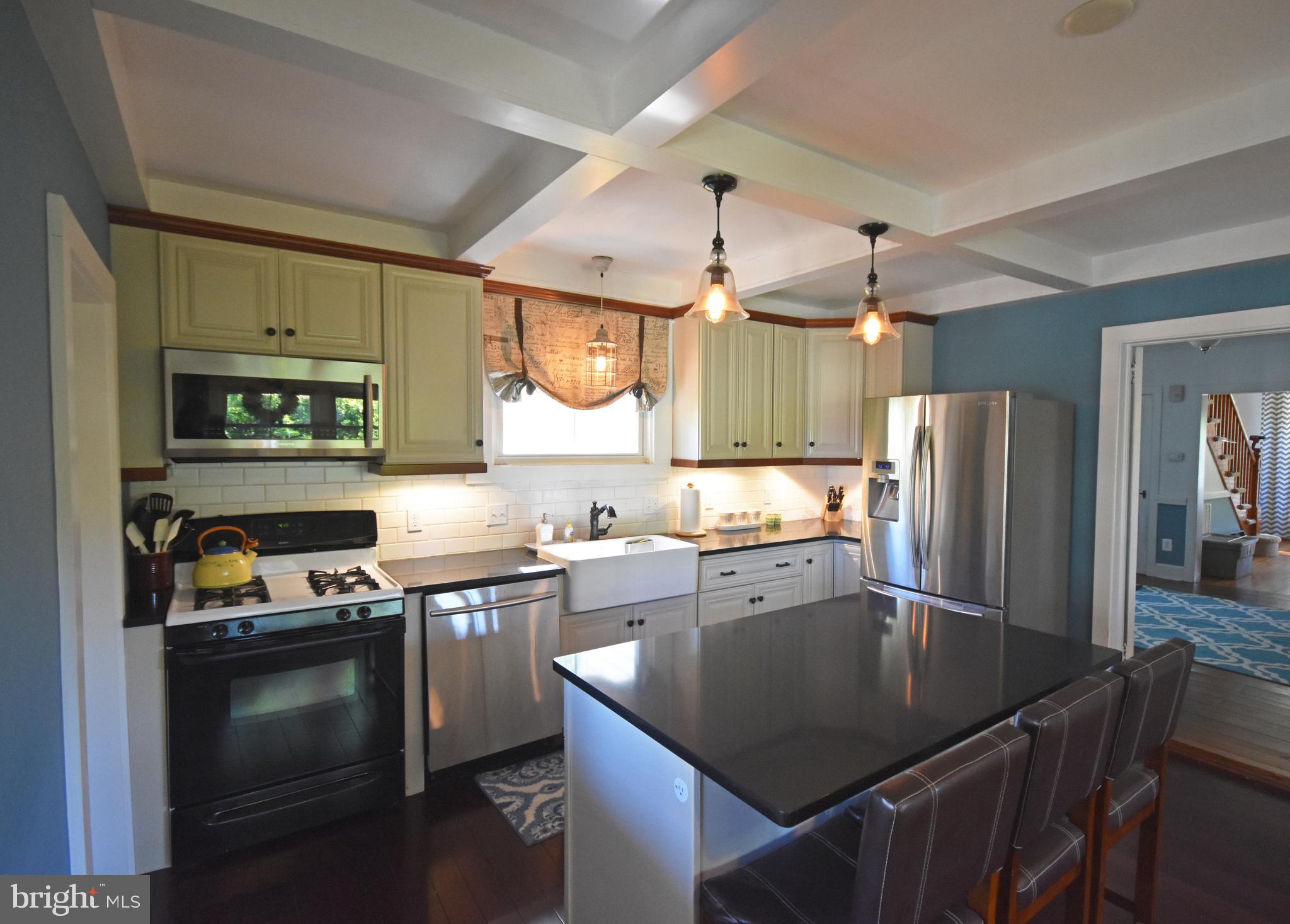 Open kitchen with coffered ceiling