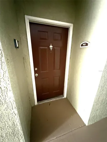 a view of hallway with livingroom