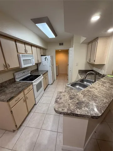 a view of a livingroom with furniture and a window
