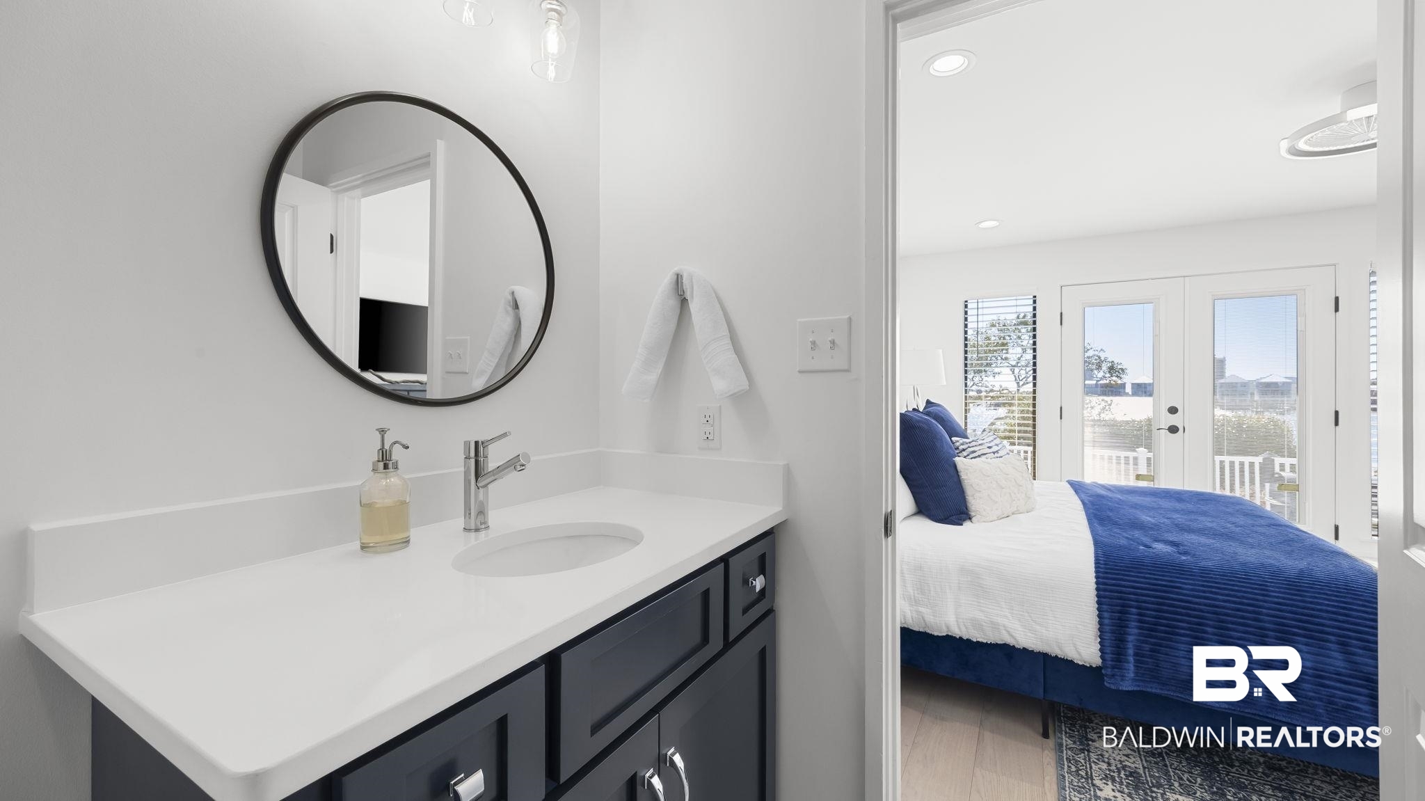 30194 River Road Orange Beach, AL 36561 - Photo 22 of 45 Ensuite bathroom with vanity, french doors, recessed lighting, and wood finished floors