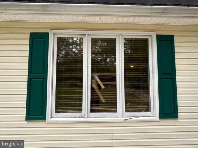 front view of a house with a tree