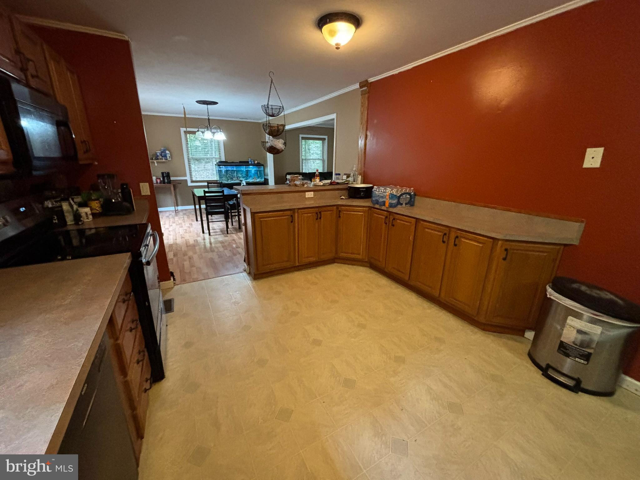 6615 Stanley Road King George, VA 22485 - Photo 5 of 30 a kitchen with stainless steel appliances a sink a stove top oven a counter space and cabinets