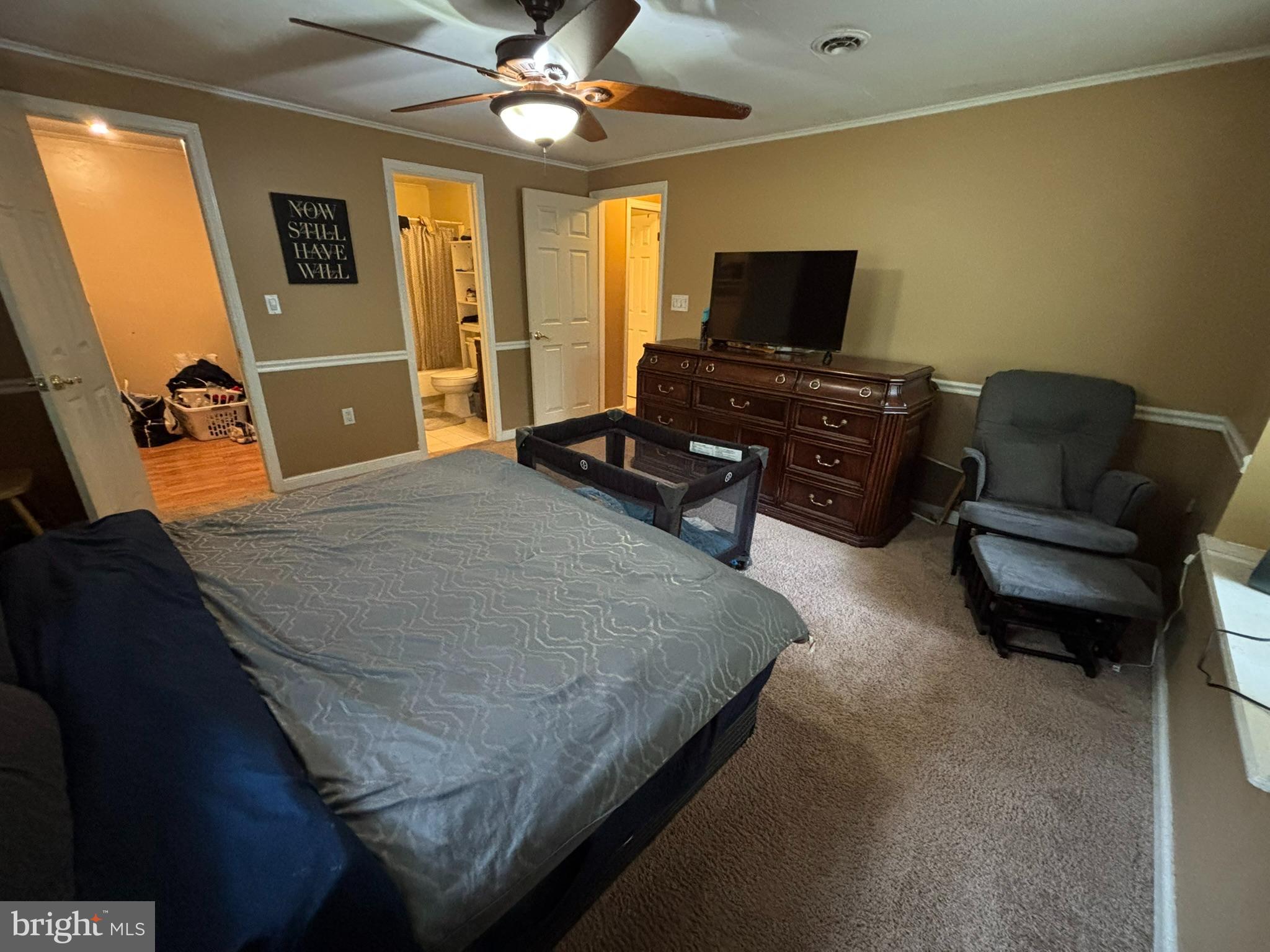 6615 Stanley Road King George, VA 22485 - Photo 9 of 30 a bedroom with a bed and a television