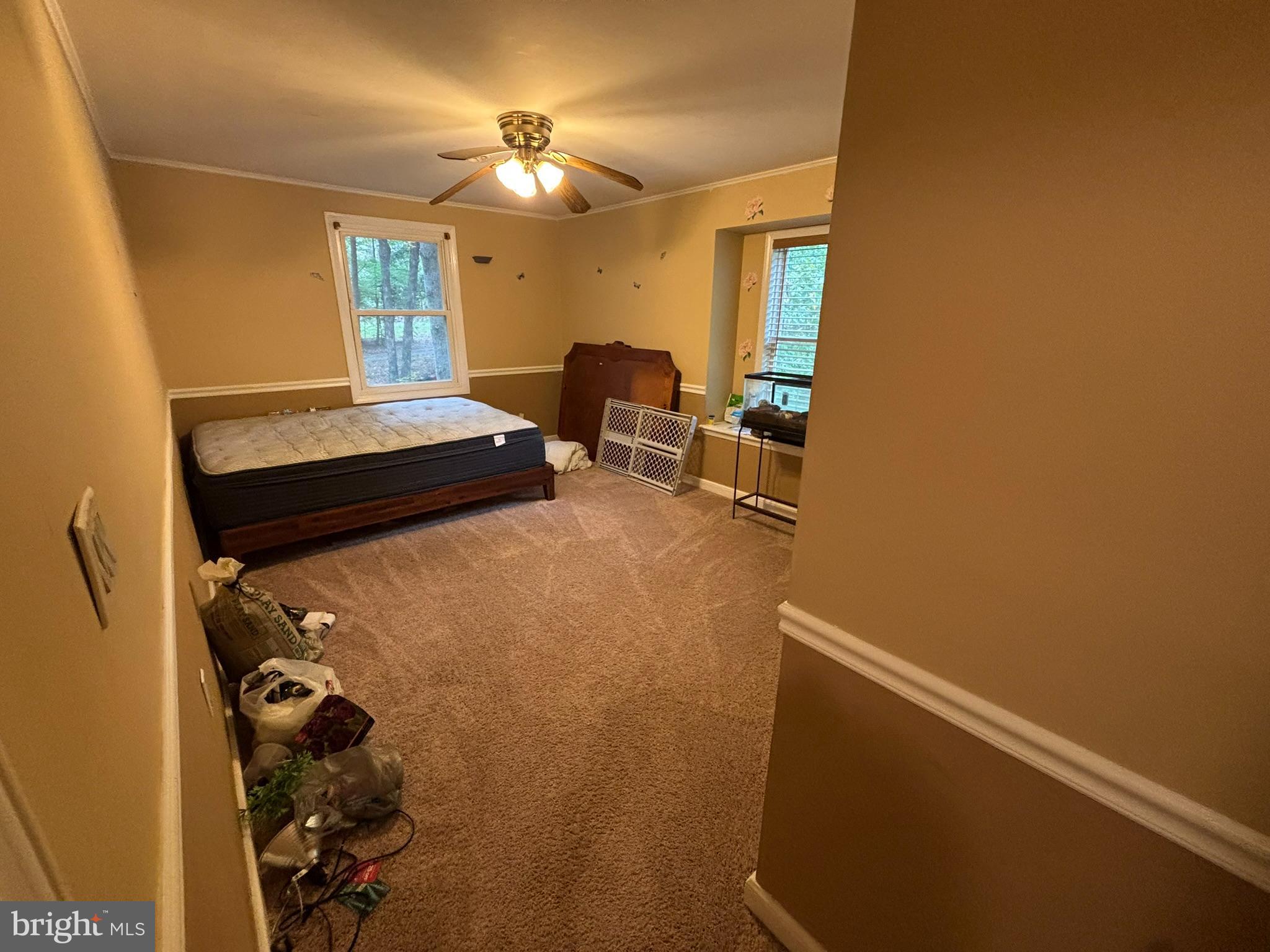 6615 Stanley Road King George, VA 22485 - Photo 10 of 30 a bedroom with a bed and a chandelier