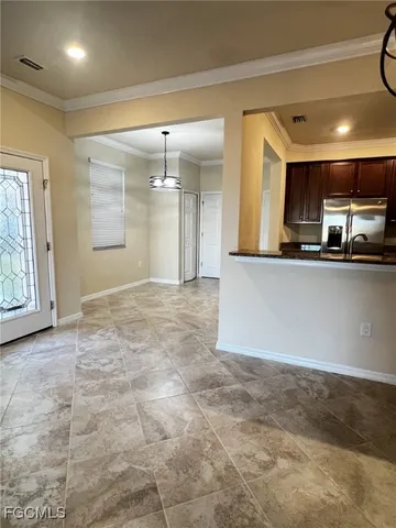 a view of a kitchen with a sink and cabinets